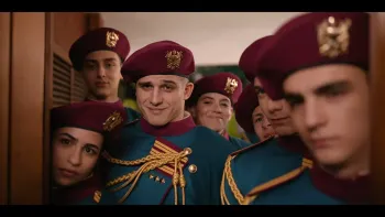 Minerva Academy TV show screenshot 2: A group of cadets in maroon berets and blue uniforms smile intimidatingly near a door.