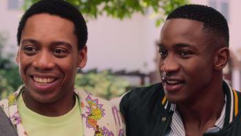 Miseducation TV show screenshot 3: Sechaba Ramphele and Lunga Shabalala smile while standing side by side.