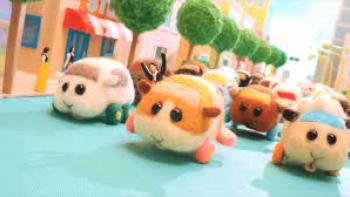 Miu Miu Polcar: Wool guinea pig cars are shown in a group going down a street.