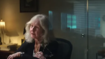 Mob War: Philadelphia vs. the Mafia TV show screenshot 1: Charlotte Lang talks from a desk.