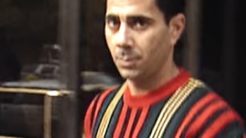 Mob War: Philadelphia vs. the Mafia TV show screenshot 2: Joey Merlino in a yellow, red, and black sweater.