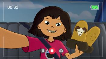 Molly's Epic Adventures TV: Molly records a selfie video of herself waving a part of mittens in the backseat of a car.