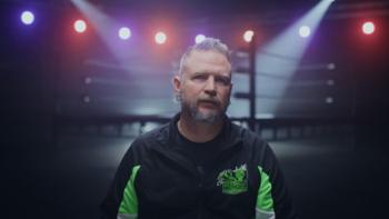 Monster Factory TV show screenshot 2: wrestling school owner Danny Cage in front of the ring