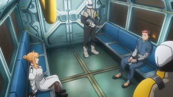 Moonrise TV show screenshot 3: Jack, in handcuffs, sits across from Inanna in a train car. A guard holding a laser gun stands watch.