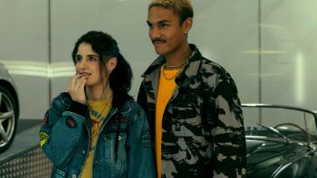 From (L to R) Caterina Forza and Davide Donin. Forza wears a jean coat and yellow shirt. Donin wears a jacket and yellow shirt.