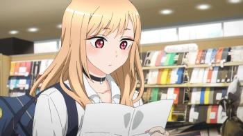 My Dress-Up Darling: Kitagawa studies a paper list of supplies while shopping for cosplay crafting materials.