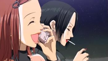 Nana: Nana K. and Nana O. sit next to each other on a train. Nana K. speaks cheerfully on her cell phone. Nana O. smokes a cigarette.