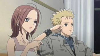 Nana: Nana K. and Nobuo sit next to each other on a couch. They look a little concerned.