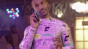 Noah's Arc: The Movie screenshot 1: Noah Nicholson in pink outfit on the phone. 