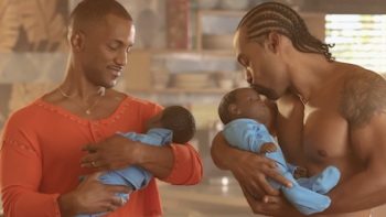 Noah's Arc: The Movie screenshot 2: Noah and Wade holding lifelike baby dolls. 