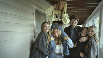 One Night In Idaho: The College Murders TV show screenshot 1: The six housemaates posing for a picture. 