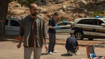 Our Boys Television: Scene 3 Forensic ivestigators gather clues in front of a phalanx of police cars. 