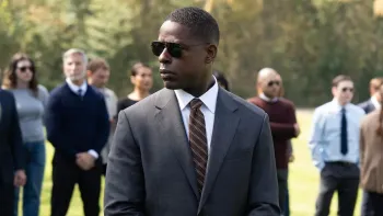 Paradise TV show screenshot 1: Xavier (Sterling K. Brown), in suit and sunglasses, surveys a crowd
