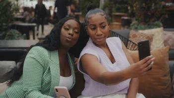 Two friends pose for a selfie