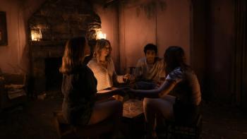 Kristina Bogic, Kavan Meegamuge, Eloise Rothfield and Jaimie Wood sit crisscross in a circle while holding hands.