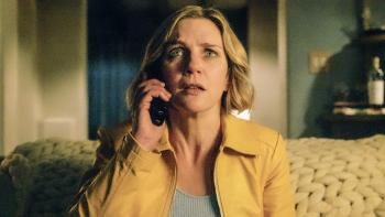 Pluribus TV show screenshot: A blonde woman, actor Rhea Seehorn, is shown looking dismayed, on the phone.