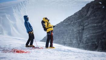 Pole to Pole with Will Smith TV show screenshot 3: In the South Pole, Will Smith and an explorer seize the moment after climbing an ice wall.