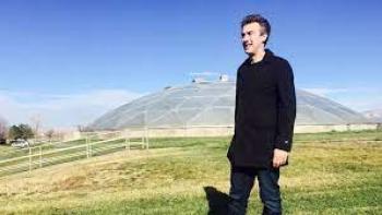 Positive Energy TV show: male host stands outdoors