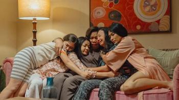 Ratu Ratu Queens TV show screenshot 3: Chinta, Party, Ance, and Eva pile onto Biyah in a group hug, as she sobs while sitting on a pink sofa