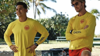 Rescue: HI-Surf TV show screenshot 2: Laka Hanohano and Will Ready in yellow and red lifeguard uniforms. 