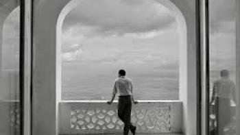 Ripley TV show screenshot: Ripley stands and looks out over the ocean. 