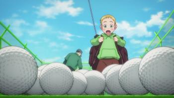 Rising Impact: Ground-up shot of Gawain staring excitedly at a bunch of golf balls.
