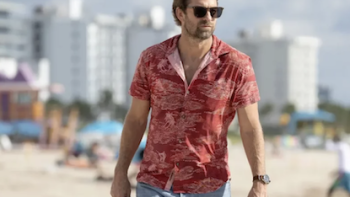 R.J. Decker TV show screenshot 1: R.J. Decker wears red shirt and walks on beach.