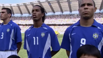 Ronaldinho: The One and Only TV show screenshot 3: Ronaldhino stands next to fellow players in white and blue uniforms before game. 