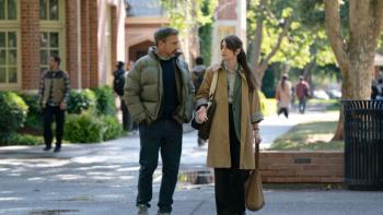Rooster TV show screenshot 1: Greg and Katie walk together on a college campus; she looks to be relating something upsetting and he looks sympathetic