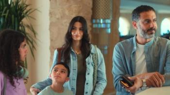 Catalog TV show screenshot: A middle-aged Arabic man leans on a counter while a teen girl with curly hair and a boy and a woman stand beside him