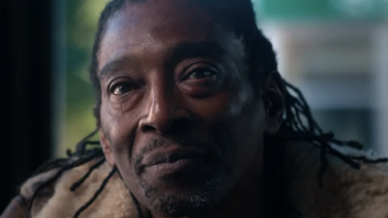 Sean Combs: The Reckoning TV show screenshot 3: Close up of Kirk Burrowes face with scraped back dreadlocks.