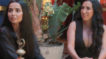 Secrets & Sisterhood TV show screenshot 3: Shakur and Rabyi sit next to each other at a party. 