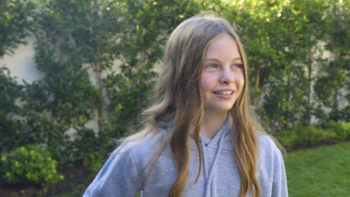 Salish and Jordan Matter TV show screenshot 3: Shalish in yard wearing light gray hoodie.