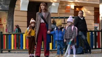 Shared Custody TV: Cris holds Cloe on one side, and her twin nephews on the other, waiting to cross a busy street.