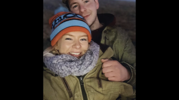 Should I Marry a Murderer? TV show screenshot: A smiling young white couple in winter clothing; the woman wears a colorful beanie.