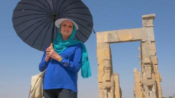 Joanna Lumley's Silk Road Adventure: Joanna Lumley stands holding a parasol, with ancient ruins behind her.