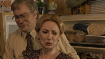 Son of a Critch TV show screenshot 2: Mark and Mary Critch stand outside open fridge. 