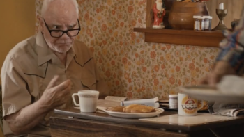Son of a Critch TV show screenshot 3: Pops is eating breakfast at table. 