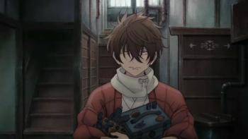 Sparks of Tomorrow TV show screenshot 1: A young man holds a mechanical device while standing inside a dimly lit building. 