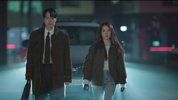 Spooky in Love TV show screenshot: A Korean man and woman walk at night on a foggy street