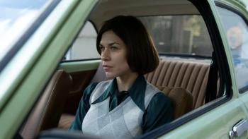 Spy/Master: a female agent waits in a car