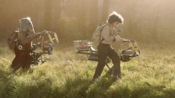 Star Wars Skeleton Crew TV Show Screenshot 2: Wim and Neel ride their hover bikes in a field