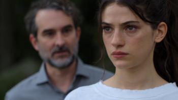 Sterling Point TV show screenshot 1: Closeup shot shows Annie looking as if she's about to cry, with Steven just behind her, mid-sentence