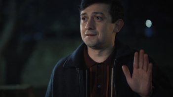 Still Up TV show screenshot 2: Danny (Craig Roberts) stands and waves in the dark.