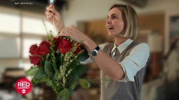 Super Scam Me:Woman arranging a bouquet of red roses.