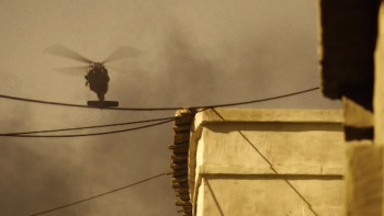 Surviving Black Hawk Down TV show screenshot 3: Black Hawk smoking in the air over buildings.