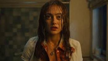 Sweetpea TV show screenshot #1:  A young White woman wears a bloodied top and looks into the camera