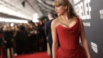 Taylor TV show screenshot 3: Taylor Swift on red carpet wearing red dress.
