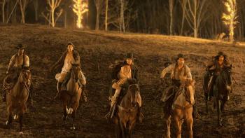 The Abandons TV show screenshot 1: Lamar Johnson, Diane Silvers, Lena Headey, Nick Robinson, and Natalia del Riego ride down a hill on horses.