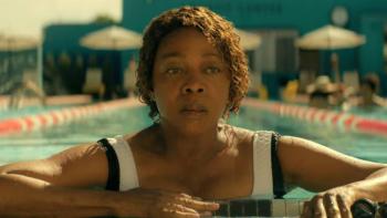 The Boroughs TV show screenshot 3: Judy stares into the distance as she rests at the end of a swimming lane, appearing weary and saddened